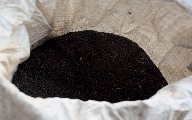 Locally produced organic fertilizer in a sack